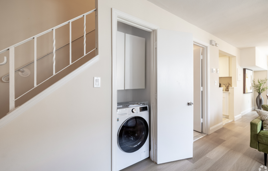 In-unit washing machine below stairs