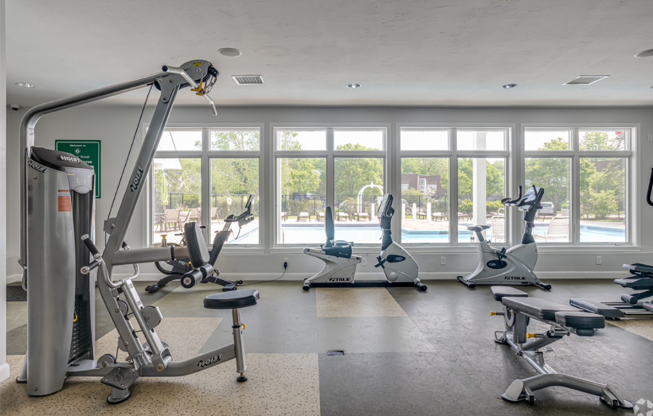 Fitness center with a bench, bikes, and strength machines